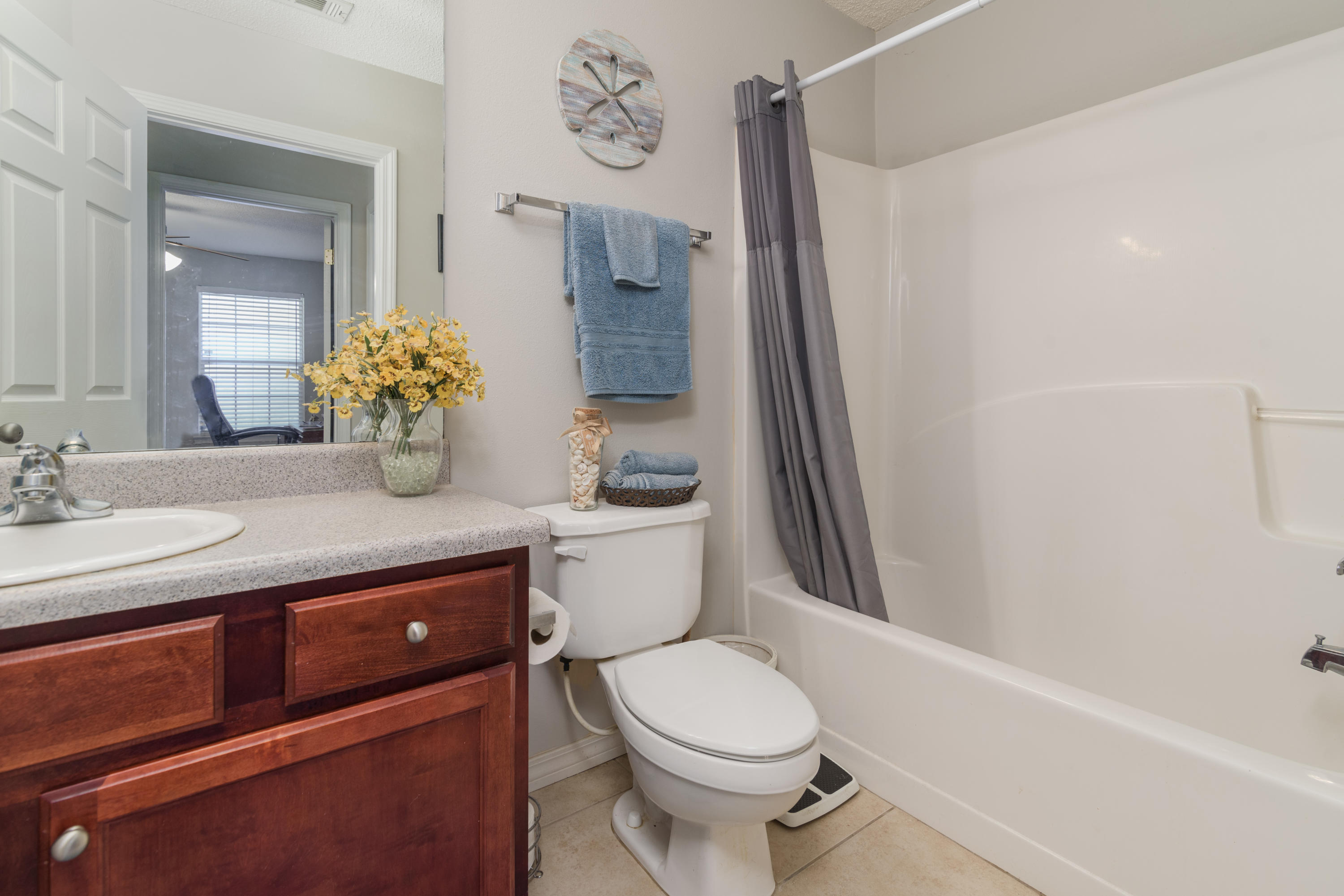 205 Tiffot Court Crestview, FL 32539 - Photo 24 of 32 a bathroom with a sink a toilet and shower