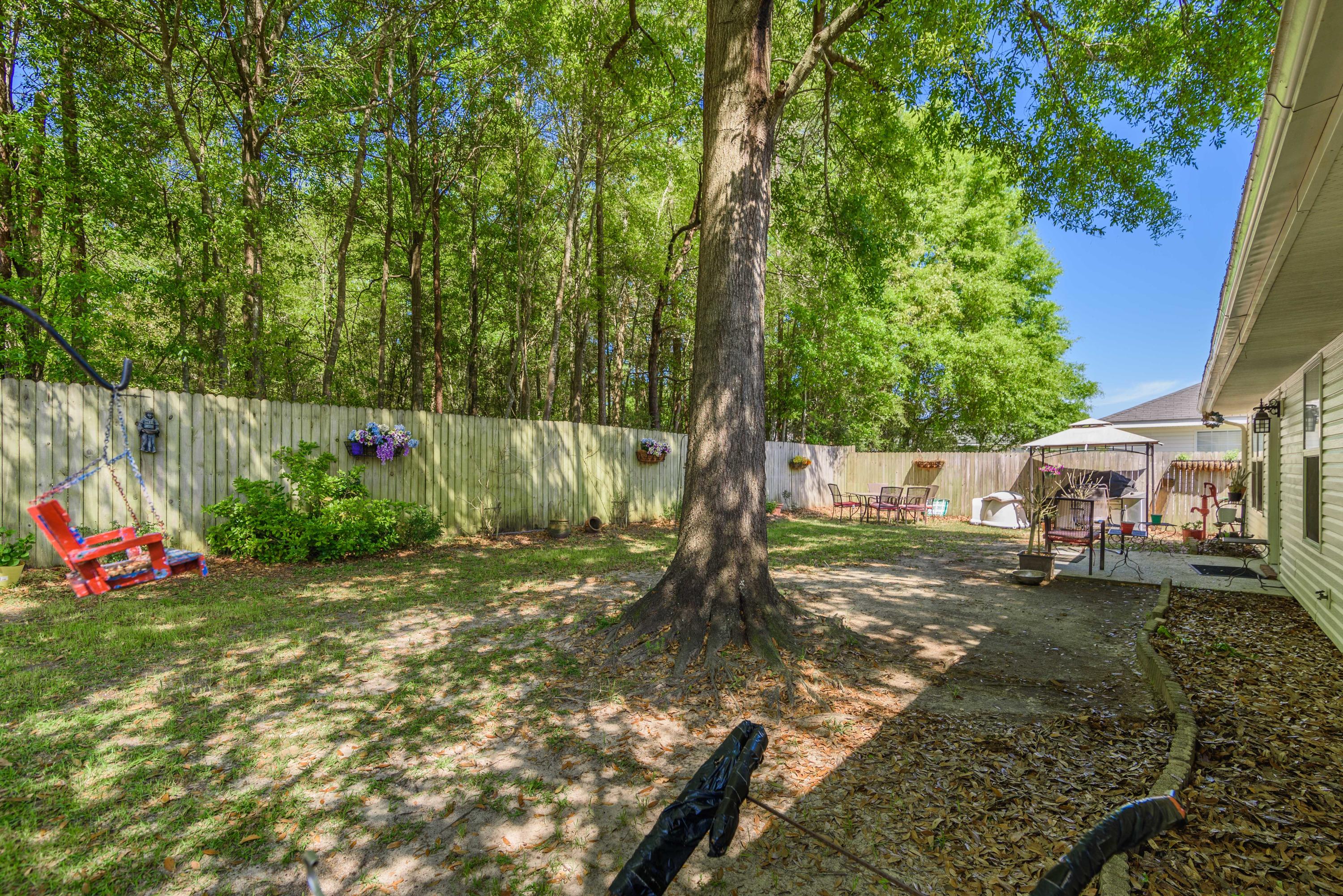 205 Tiffot Court Crestview, FL 32539 - Photo 30 of 32 a view of a backyard with a tree