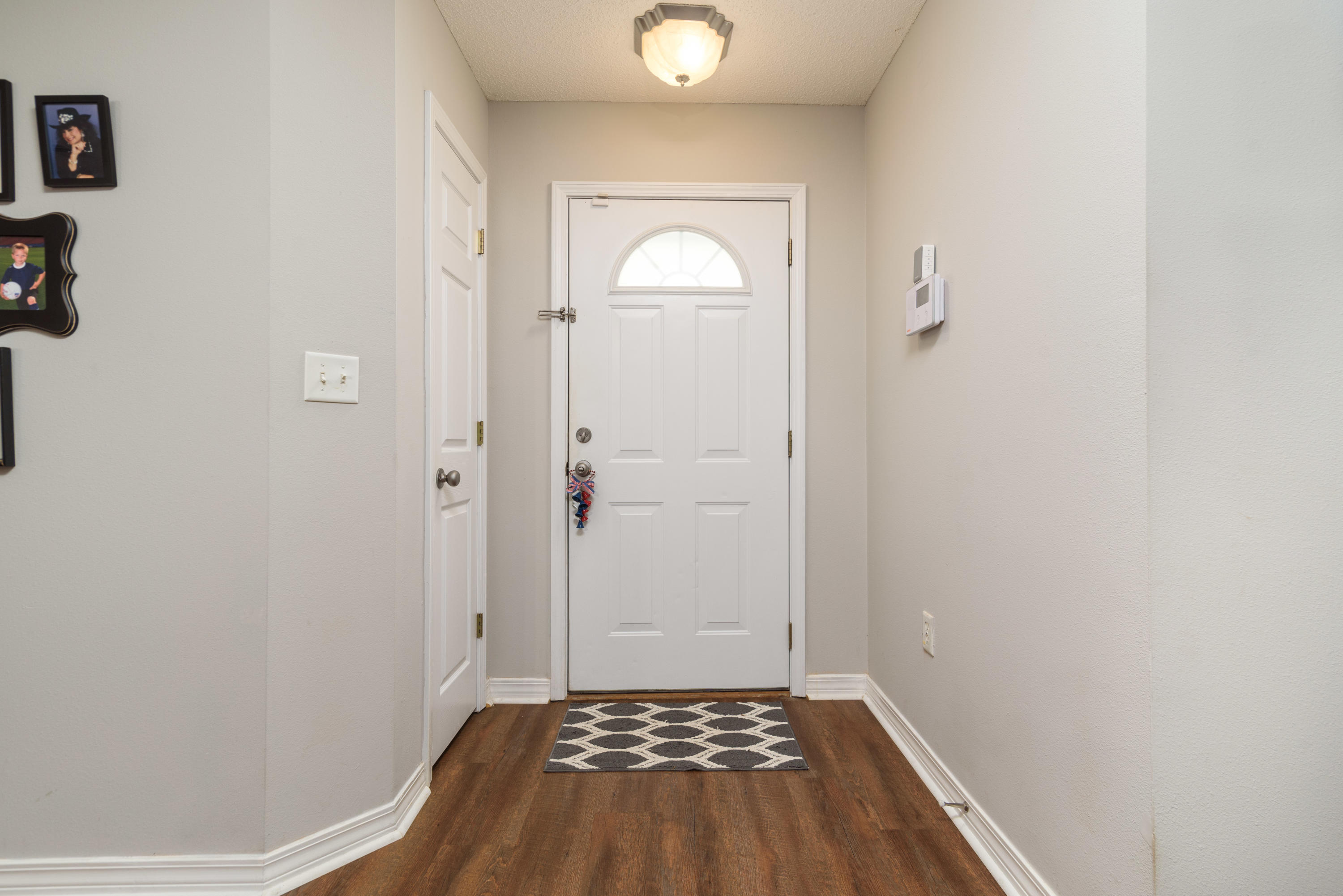 205 Tiffot Court Crestview, FL 32539 - Photo 4 of 32 a view of a room with wooden floor and a window