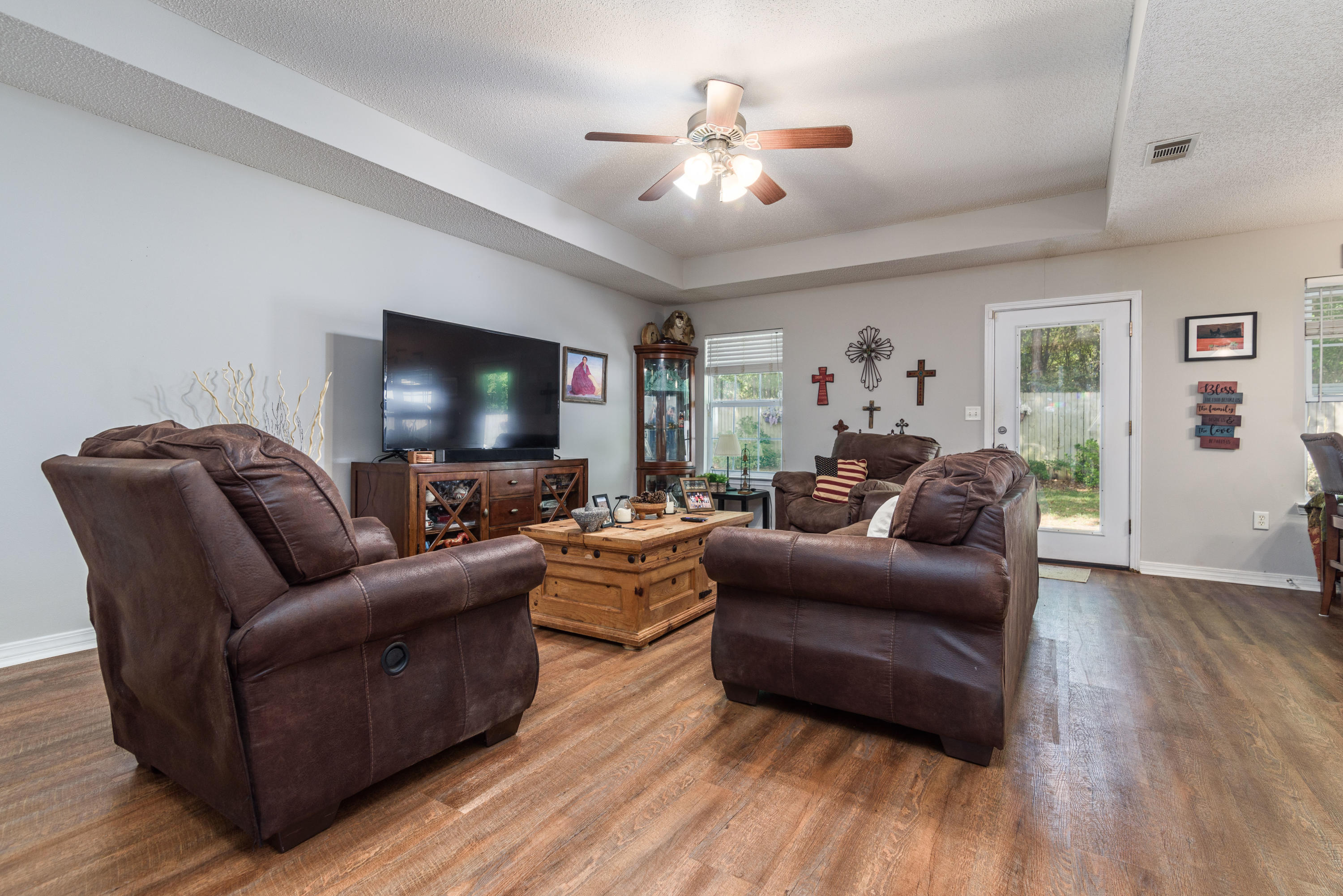 205 Tiffot Court Crestview, FL 32539 - Photo 5 of 32 a living room with furniture and a flat screen tv