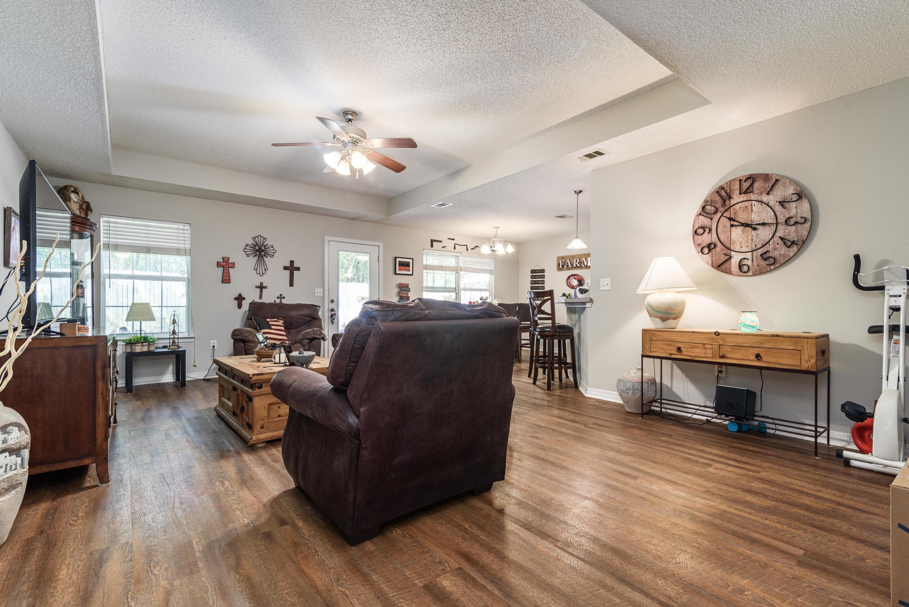205 Tiffot Court Crestview, FL 32539 - Photo 6 of 32 a living room with furniture and a fireplace