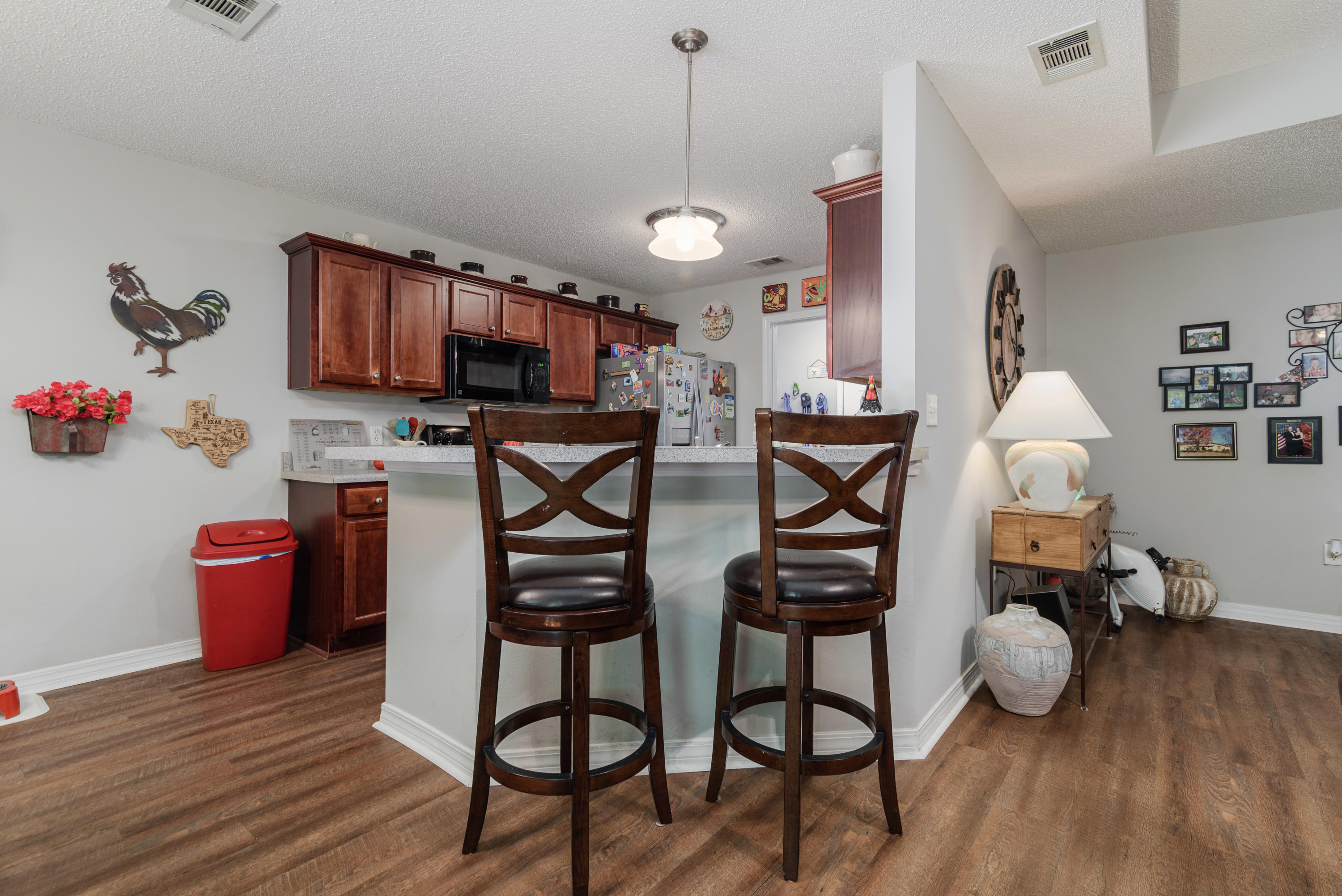205 Tiffot Court Crestview, FL 32539 - Photo 10 of 32 a view of a dining room with furniture and wooden floor
