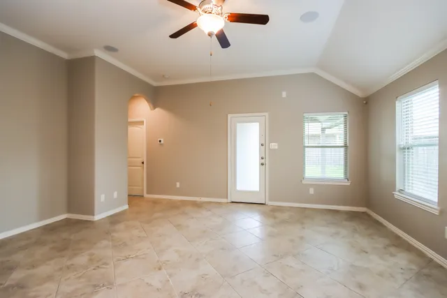 a view of an empty room with a window