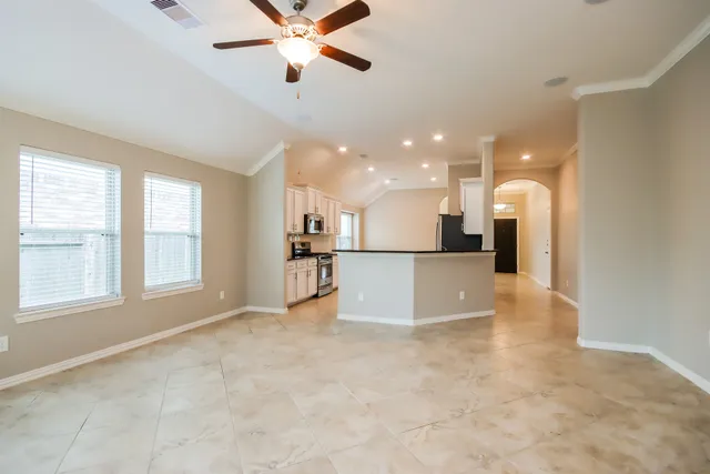 a view of a kitchen with a sink and a window