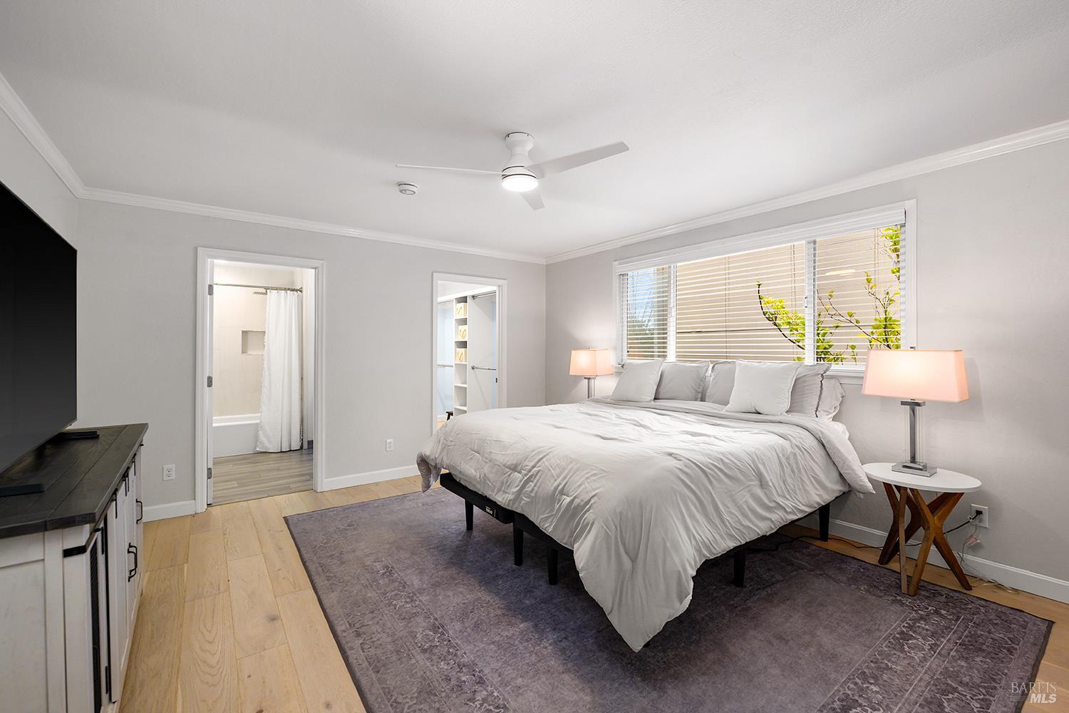 5313 Yerba Buena Road Santa Rosa, CA 95409 - Photo 12 of 34 Privately situated on its own side of the home, the spacious primary suite offers a peaceful retreat complete with an updated en-suite bathroom and generous walk-in closet.