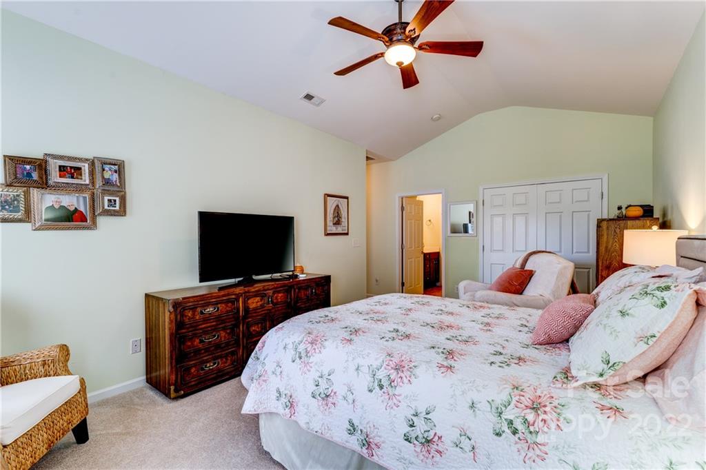 608 Amethyst Circle Fort Mill, SC 29708 - Photo 11 of 28 a bedroom with a bed and a flat screen tv
