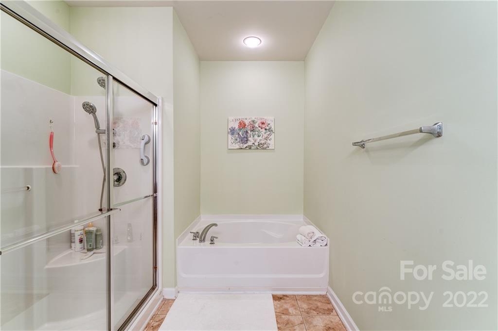 608 Amethyst Circle Fort Mill, SC 29708 - Photo 13 of 28 a bathroom with a bathtub and a shower