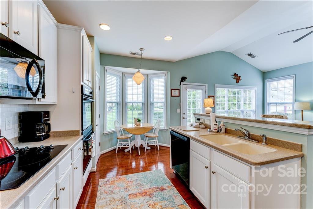 608 Amethyst Circle Fort Mill, SC 29708 - Photo 18 of 28 a open kitchen with stainless steel appliances granite countertop a sink stove and refrigerator