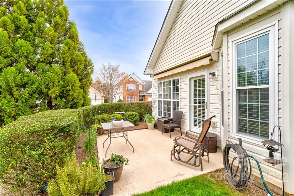 608 Amethyst Circle Fort Mill, SC 29708 - Photo 19 of 28 a view of a patio with table and chairs and potted plants