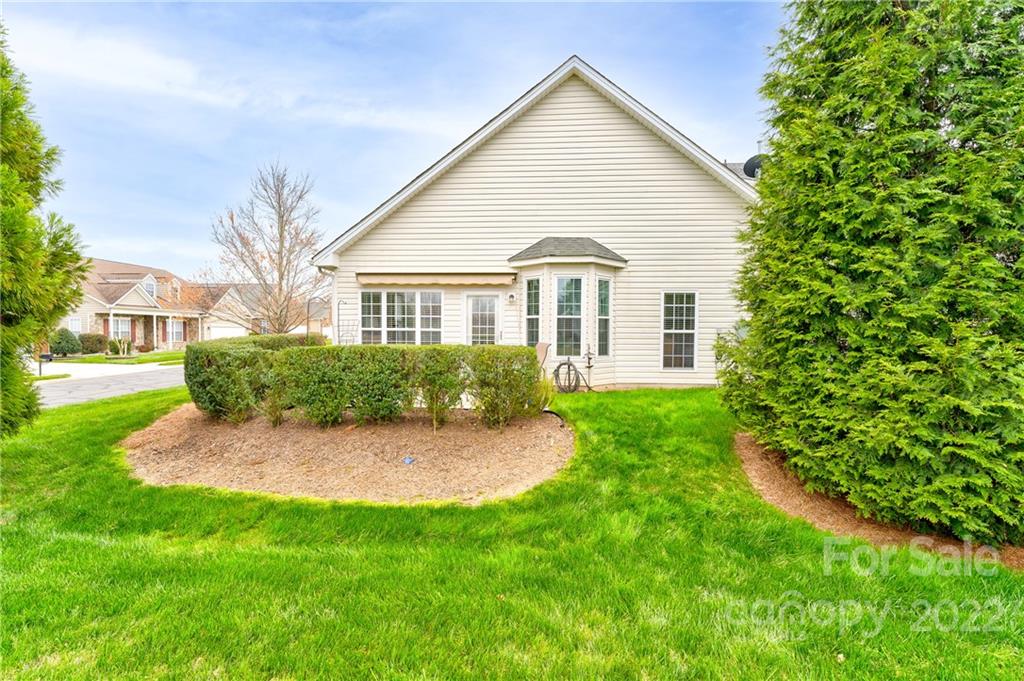 608 Amethyst Circle Fort Mill, SC 29708 - Photo 20 of 28 a front view of a house with a yard and potted plants