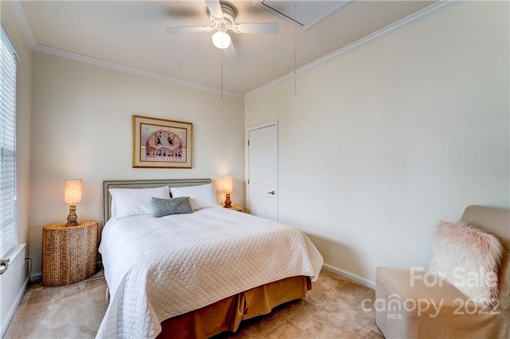 608 Amethyst Circle Fort Mill, SC 29708 - Photo 8 of 28 a spacious bedroom with a bed and a lamp