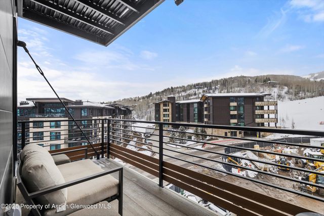 a view of a balcony with furniture