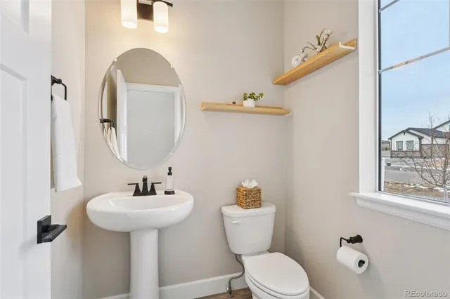 a spacious bathroom with a sink and a mirror