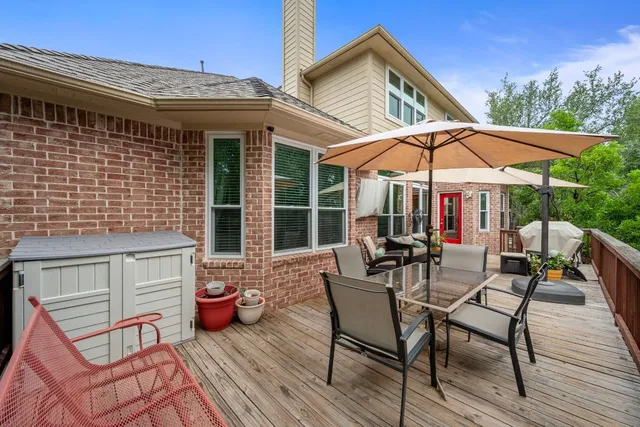 a view of a chairs and table in the patio