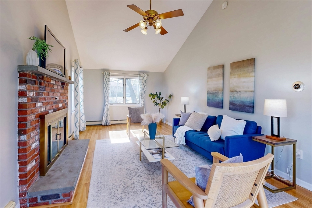 1 Hodge Road Arlington, MA 02474 - Photo 13 of 39 a living room with fireplace furniture and a wooden floor