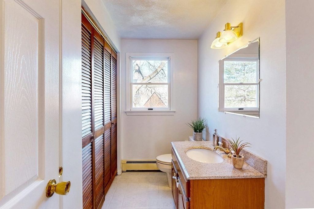 1 Hodge Road Arlington, MA 02474 - Photo 16 of 39 a bathroom with a sink and a mirror