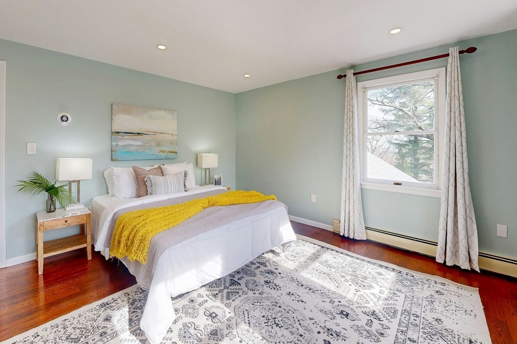 1 Hodge Road Arlington, MA 02474 - Photo 18 of 39 a bedroom with a large bed and a window