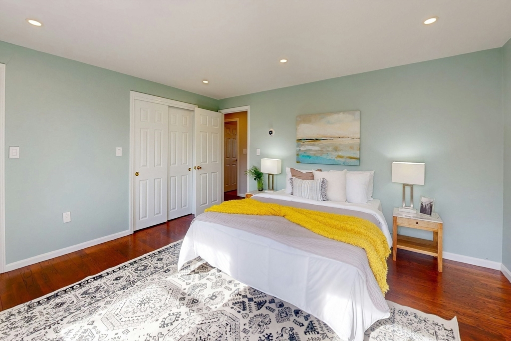 1 Hodge Road Arlington, MA 02474 - Photo 19 of 39 a bedroom with a bed and a lamp