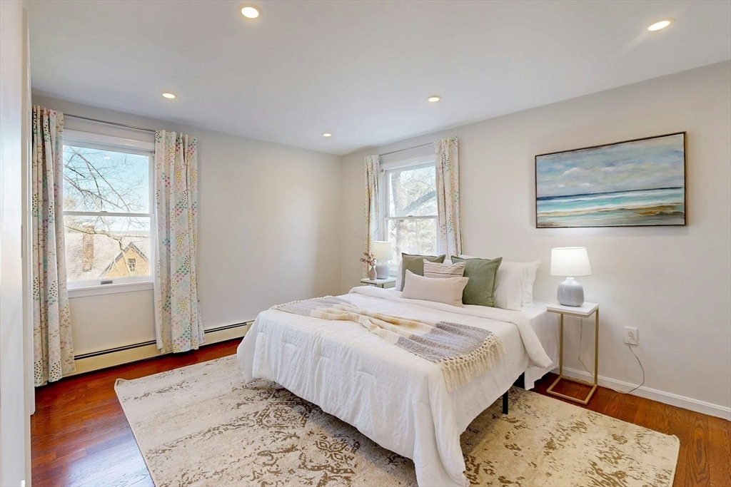 1 Hodge Road Arlington, MA 02474 - Photo 21 of 39 a bedroom with a large bed and a window