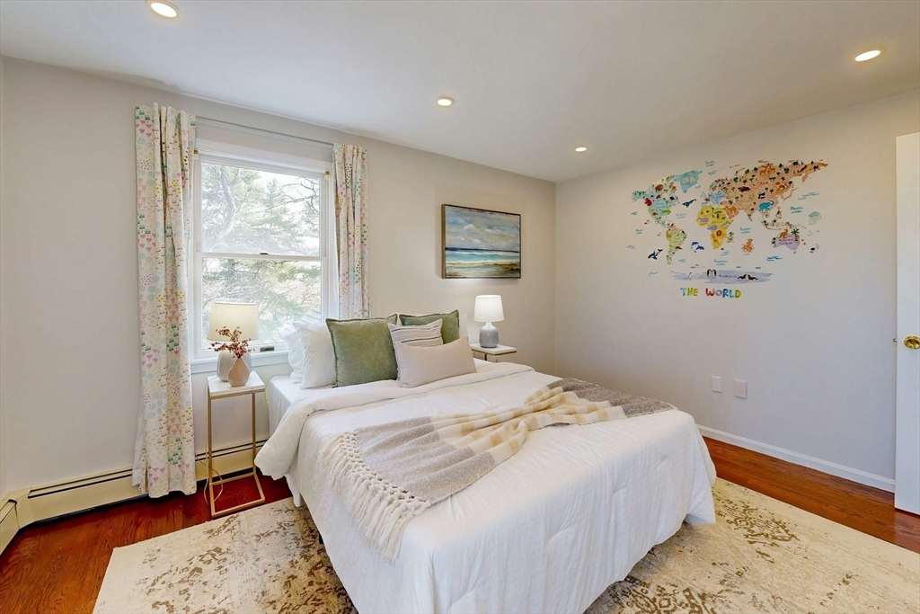 1 Hodge Road Arlington, MA 02474 - Photo 23 of 39 a bedroom with a bed and a window