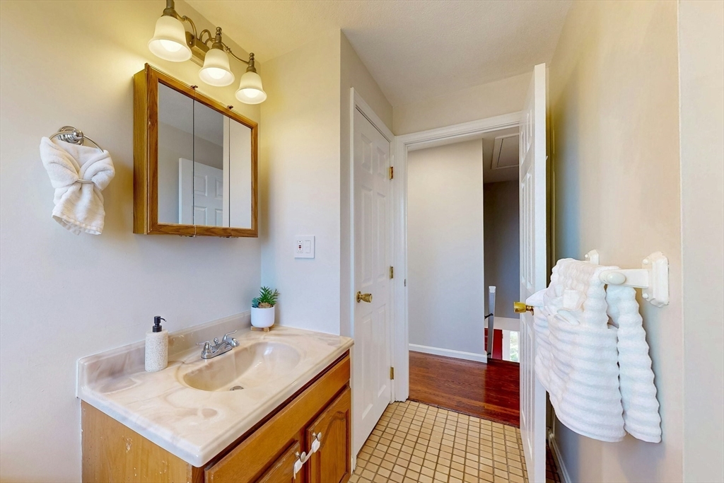 1 Hodge Road Arlington, MA 02474 - Photo 24 of 39 a bathroom with a sink and a mirror