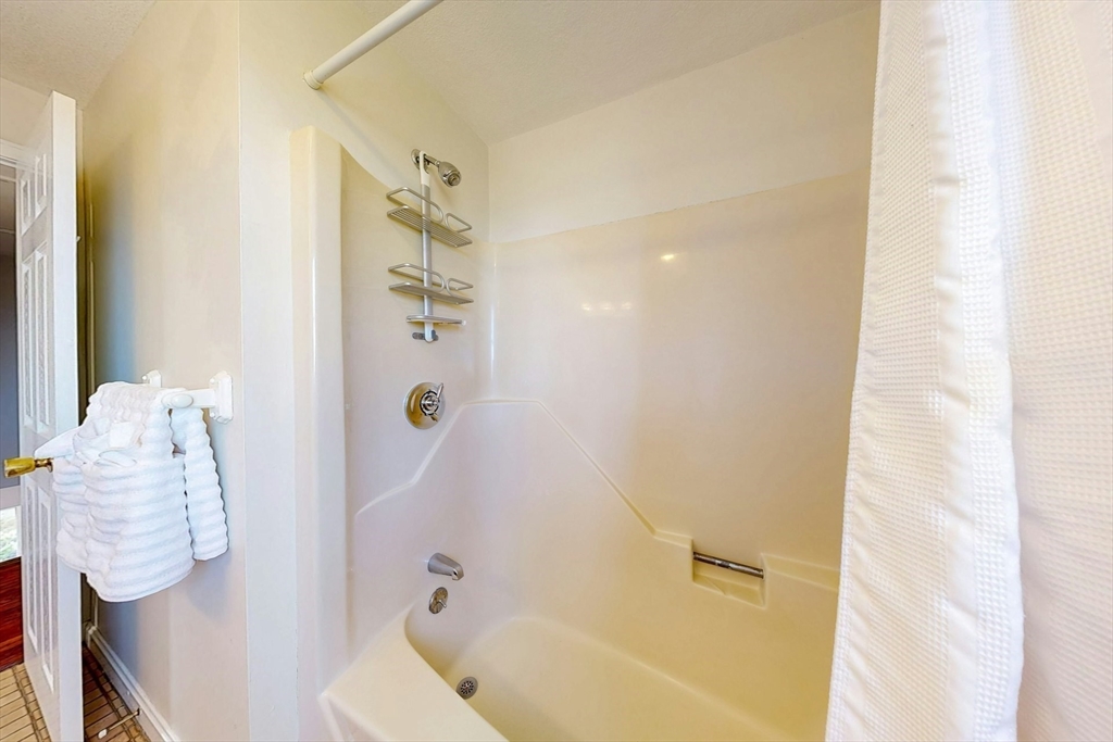 1 Hodge Road Arlington, MA 02474 - Photo 25 of 39 a bathroom with a bathtub