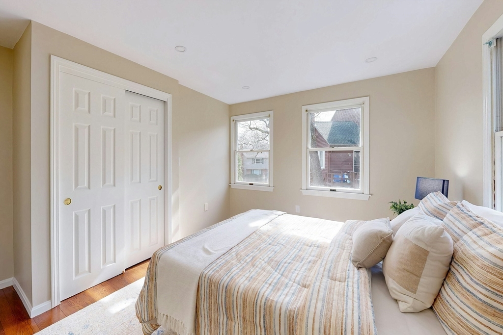 1 Hodge Road Arlington, MA 02474 - Photo 27 of 39 a bedroom with a bed and a window