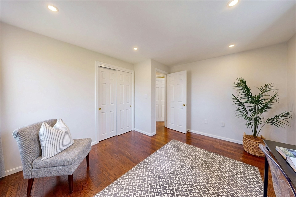 1 Hodge Road Arlington, MA 02474 - Photo 30 of 39 a bedroom with a bed and a couch