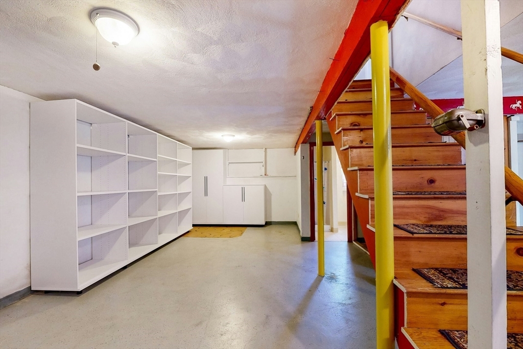 1 Hodge Road Arlington, MA 02474 - Photo 31 of 39 a view of walk in closet with clothes and shoes