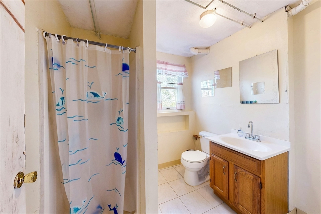 1 Hodge Road Arlington, MA 02474 - Photo 34 of 39 a bathroom with a sink mirror toilet and shower