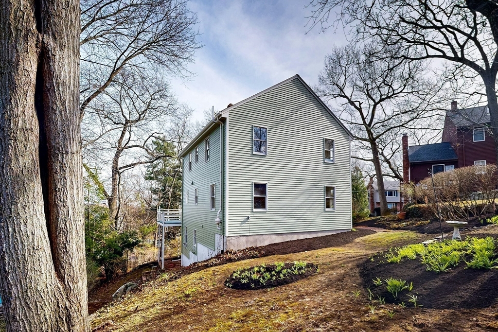 1 Hodge Road Arlington, MA 02474 - Photo 38 of 39 a backyard of a house with lots of green space