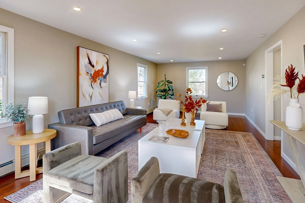 1 Hodge Road Arlington, MA 02474 - Photo 4 of 39 a living room with furniture and a wooden floor