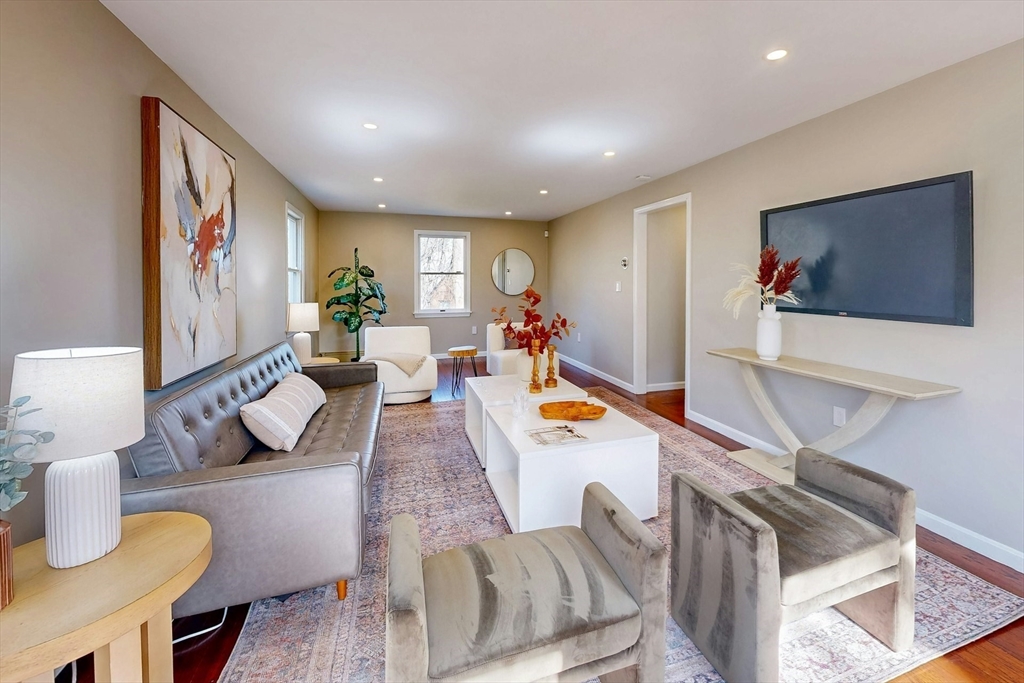 1 Hodge Road Arlington, MA 02474 - Photo 5 of 39 a living room with furniture kitchen view and a large window