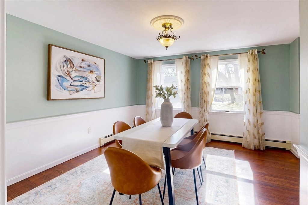 1 Hodge Road Arlington, MA 02474 - Photo 7 of 39 a view of a dining room with furniture and wooden floor