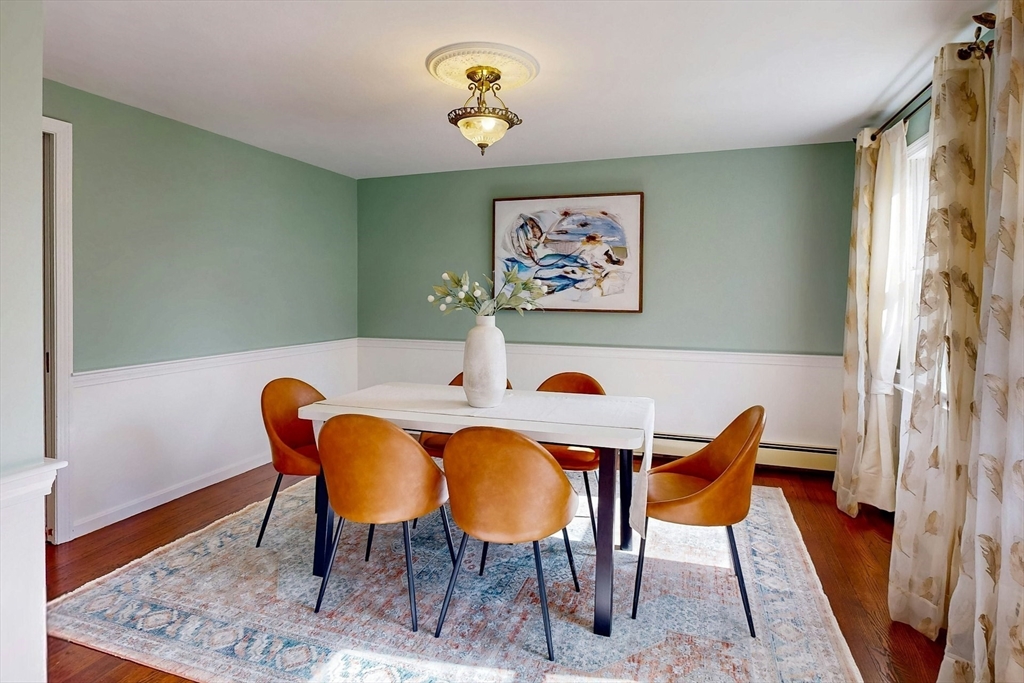 1 Hodge Road Arlington, MA 02474 - Photo 8 of 39 a view of a dining room with furniture and wooden floor