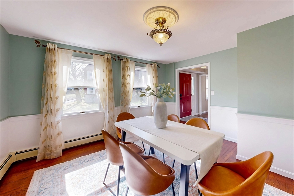1 Hodge Road Arlington, MA 02474 - Photo 9 of 39 a view of a dining room with furniture window and wooden floor