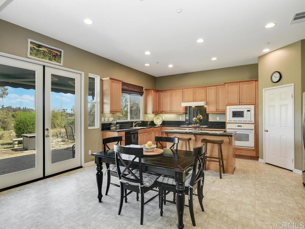 190 Mission Oaks Road Fallbrook, CA 92028 - Photo 13 of 50 a kitchen with a table and chairs in it