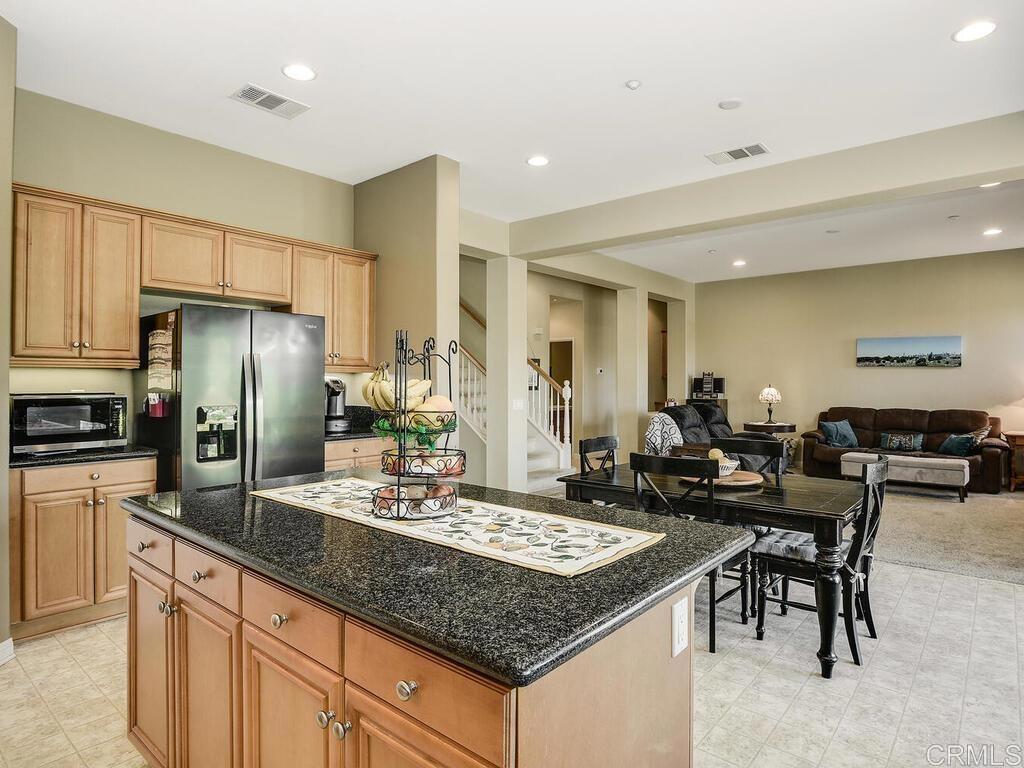 190 Mission Oaks Road Fallbrook, CA 92028 - Photo 16 of 50 a kitchen with granite countertop lots of counter top space and stainless steel appliances