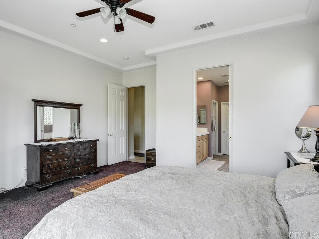 190 Mission Oaks Road Fallbrook, CA 92028 - Photo 23 of 50 a spacious bedroom with a bed and cabinets