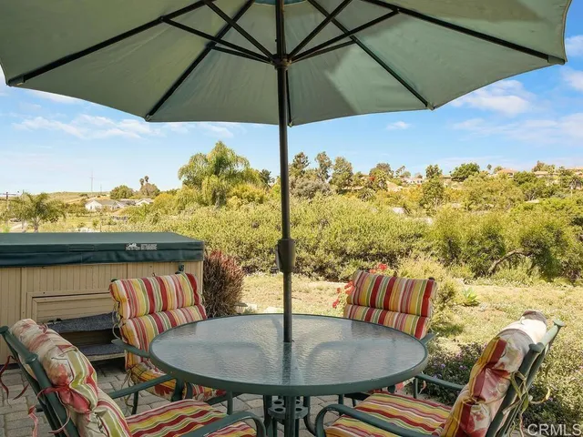 swimming pool view with a seating space