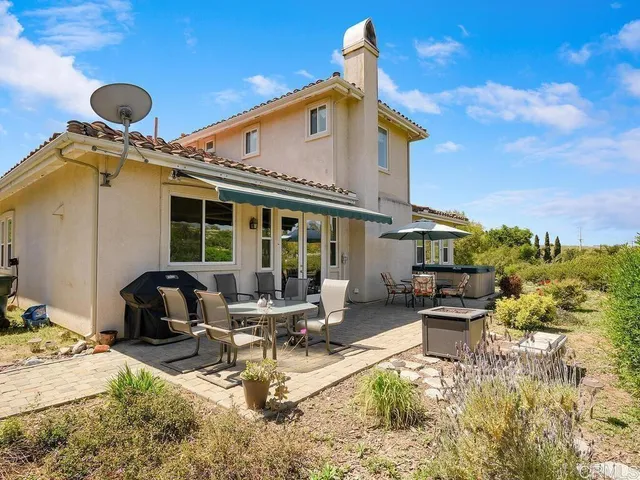 a front view of a house with patio