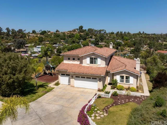 an aerial view of a house with a garden