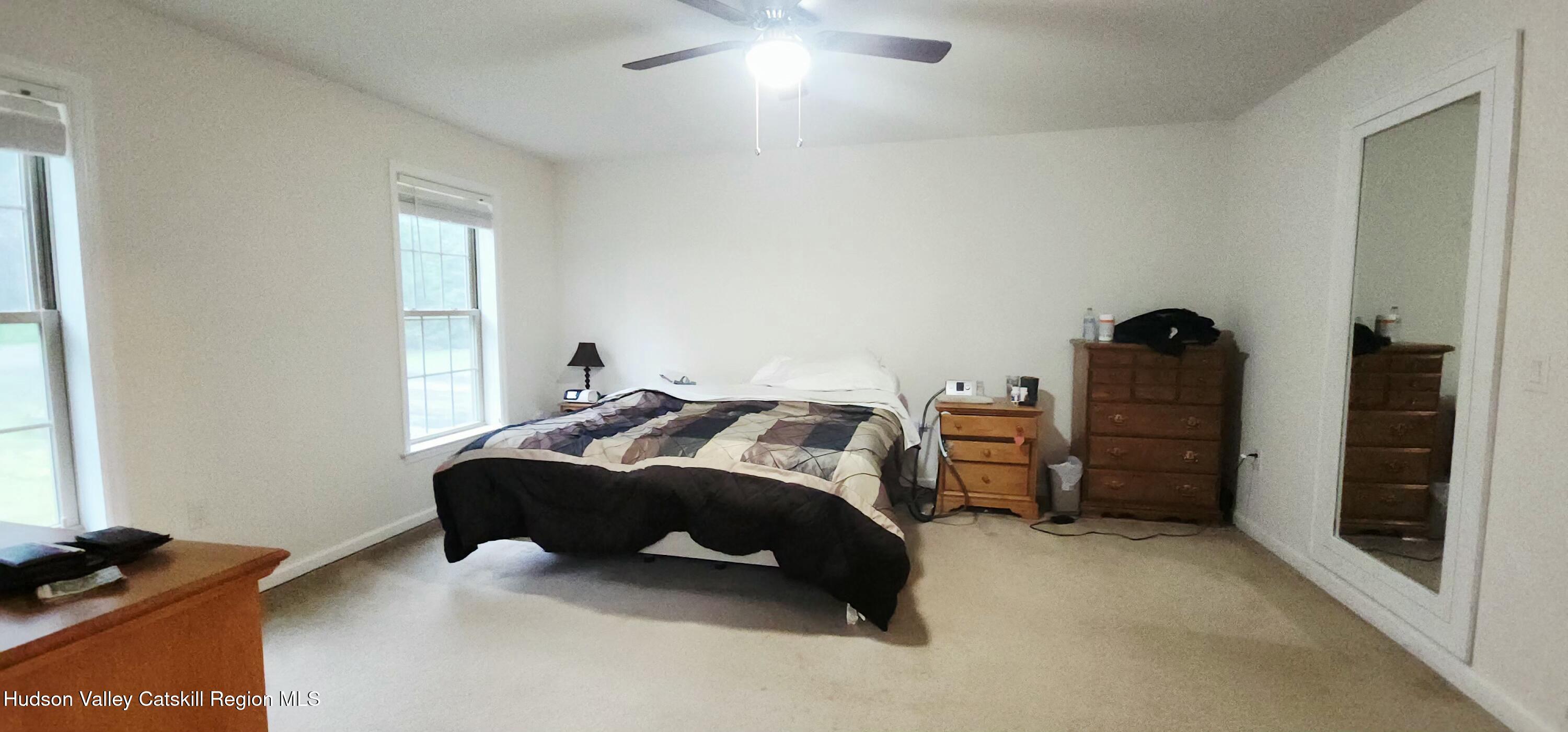 89 Zinno Road Ashland, NY 12496 - Photo 18 of 37 a bedroom with a bed and a window