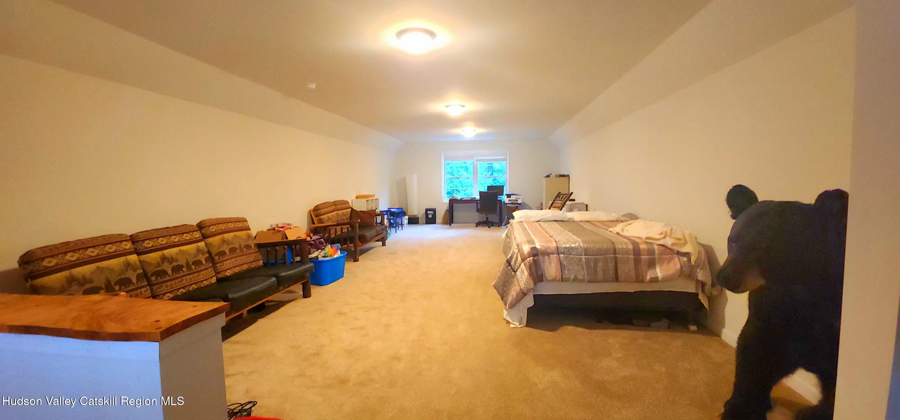 89 Zinno Road Ashland, NY 12496 - Photo 20 of 37 a bed room with furniture and gym equipment