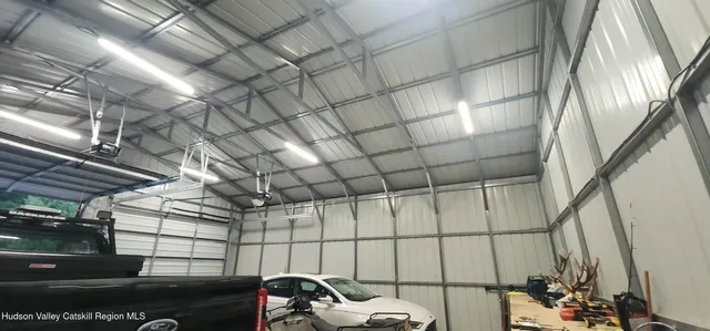 a view of a house with a yard porch and sitting area