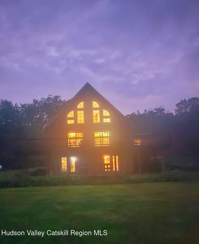 a night view of a big room with a big yard