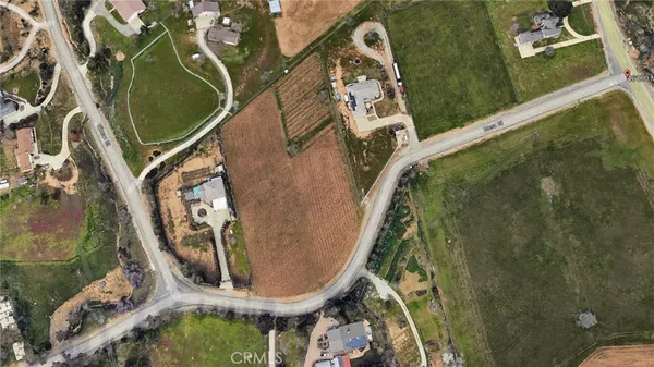 an aerial view of a highlighted house