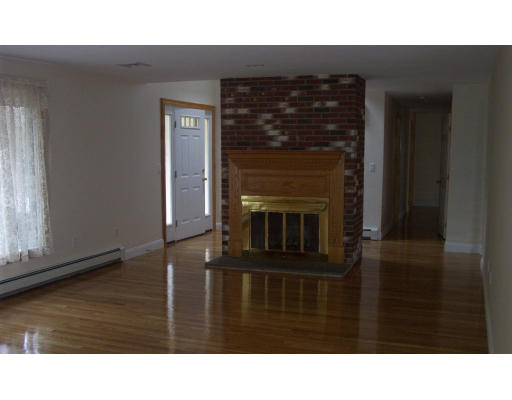 576 Grove Street Framingham, MA 01701 - Photo 5 of 8 a black and white photo of a living room