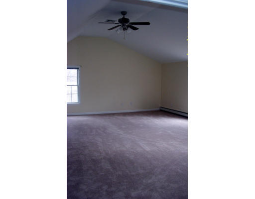 576 Grove Street Framingham, MA 01701 - Photo 6 of 8 a view of a room with a ceiling fan
