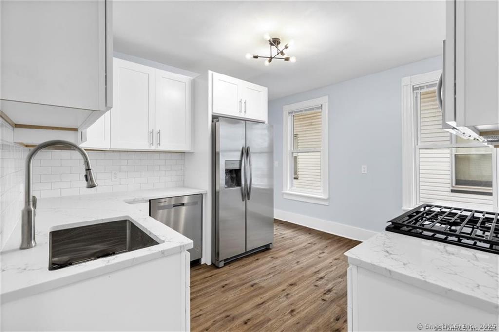 55 Admiral Street, Unit 2 New Haven, CT 06511 - Photo 11 of 35 a kitchen with a stove a refrigerator and a sink